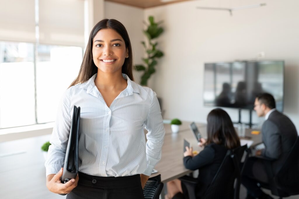 Tangentia|Hispanic female business professional in office boardroom